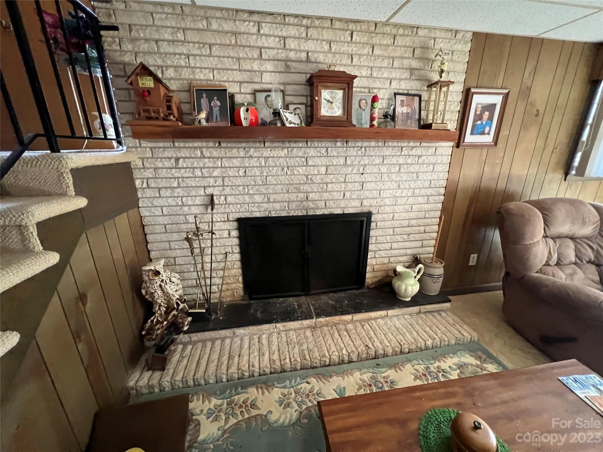 682 Summers Road Valdese, NC 28690 - Photo 43 of 45 a living room with furniture and a fireplace