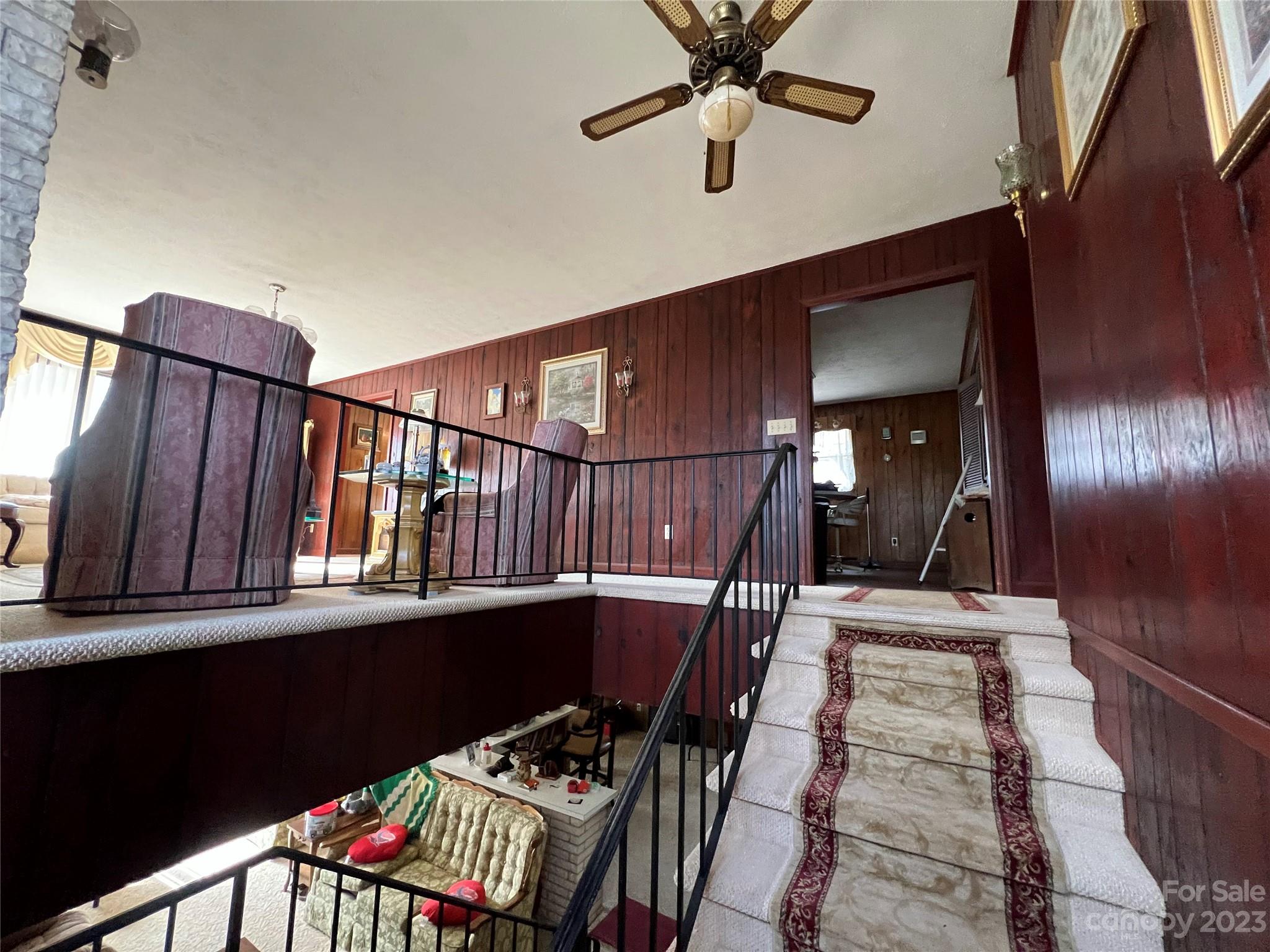 682 Summers Road Valdese, NC 28690 - Photo 44 of 45 a view of staircase with wooden floor and fan
