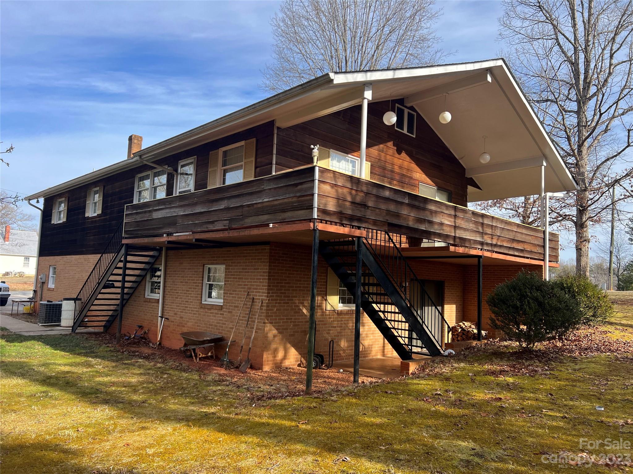 682 Summers Road Valdese, NC 28690 - Photo 5 of 45 a view of a house with a swimming pool