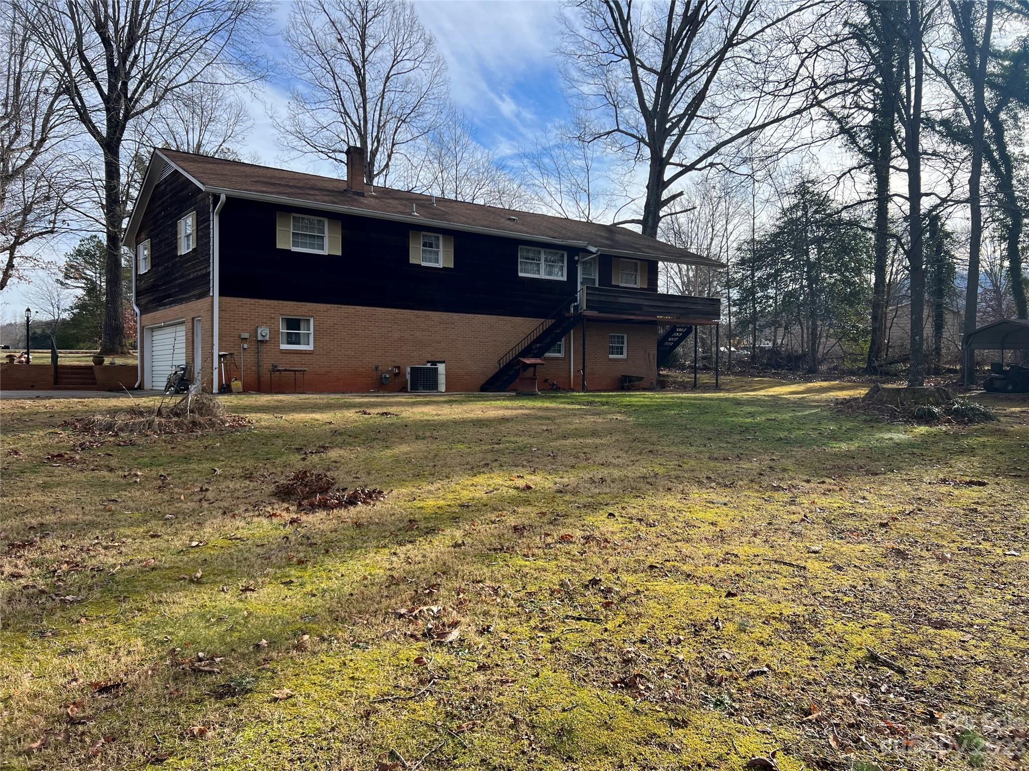 682 Summers Road Valdese, NC 28690 - Photo 8 of 45 a view of a house with a yard covered with trees