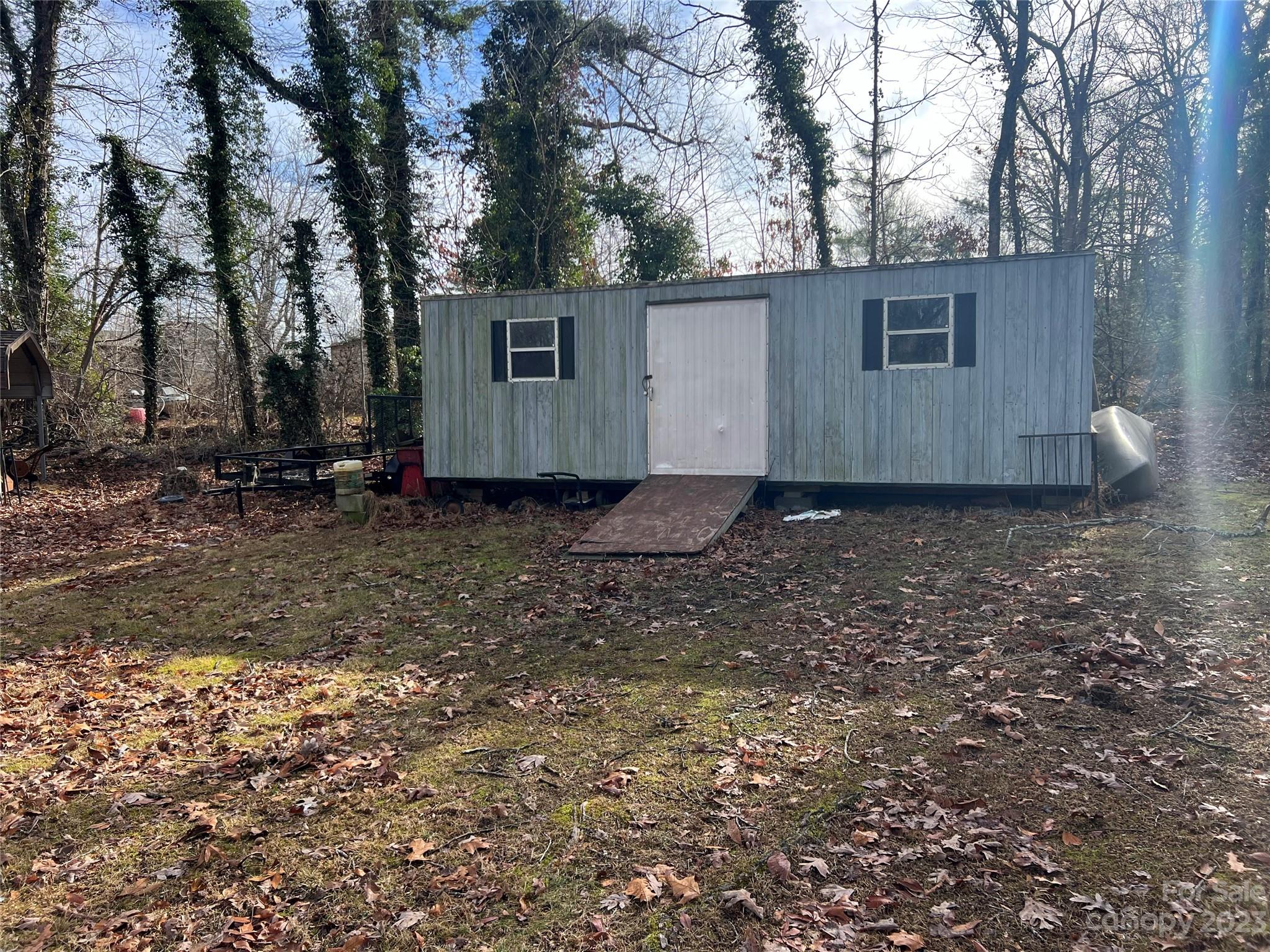 682 Summers Road Valdese, NC 28690 - Photo 10 of 45 a backyard of a house with lots of green space