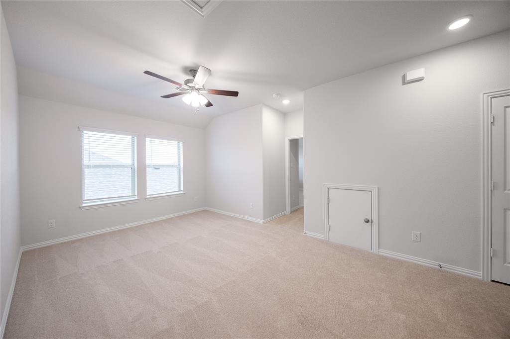 2606 Hawkins Street Anna, TX 75409 - Photo 6 of 31 an empty room with windows and fan