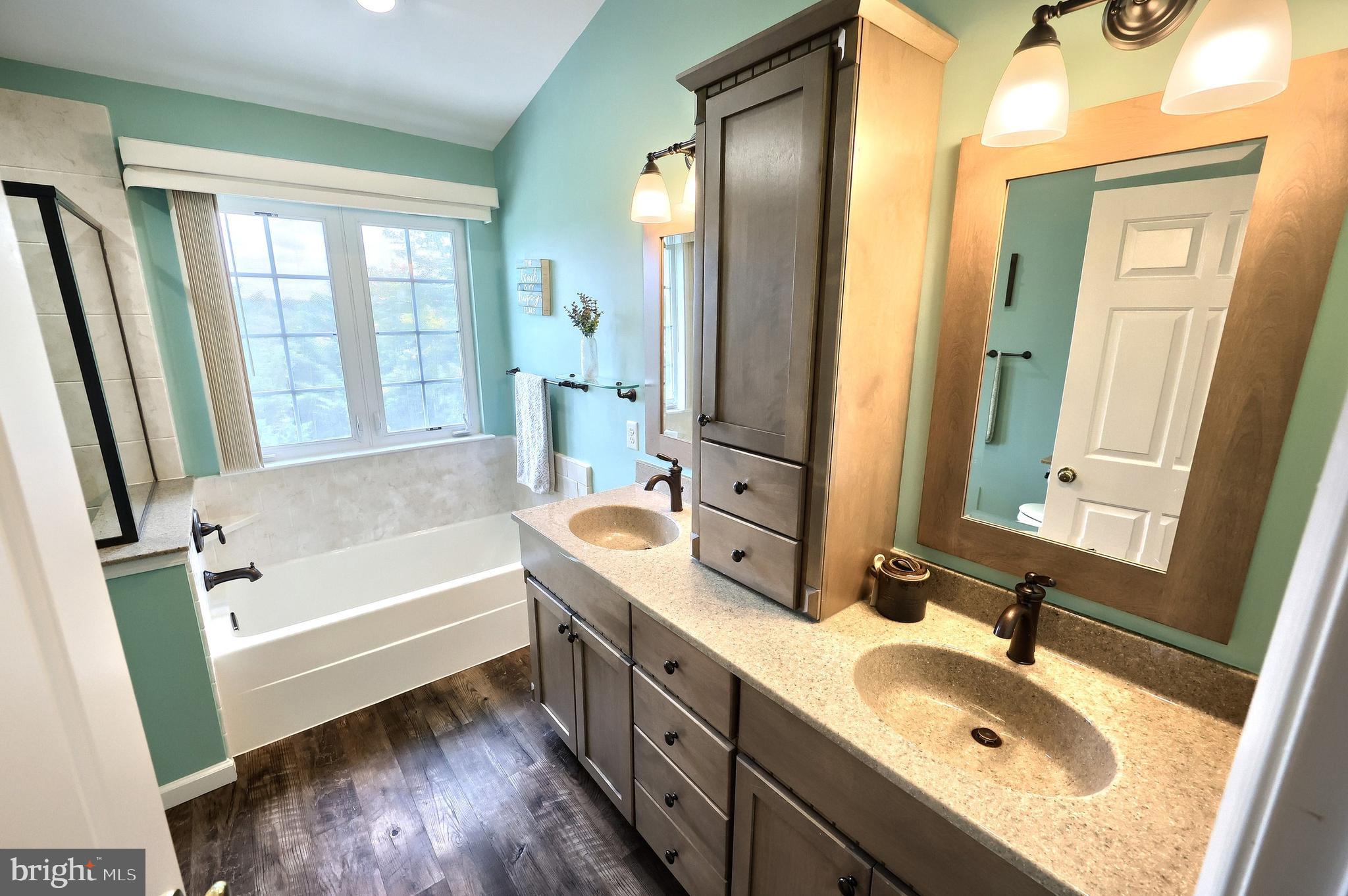 44 Smith Mill Road New Freedom, PA 17349 - Photo 28 of 51 a bathroom with a tub sink and mirror