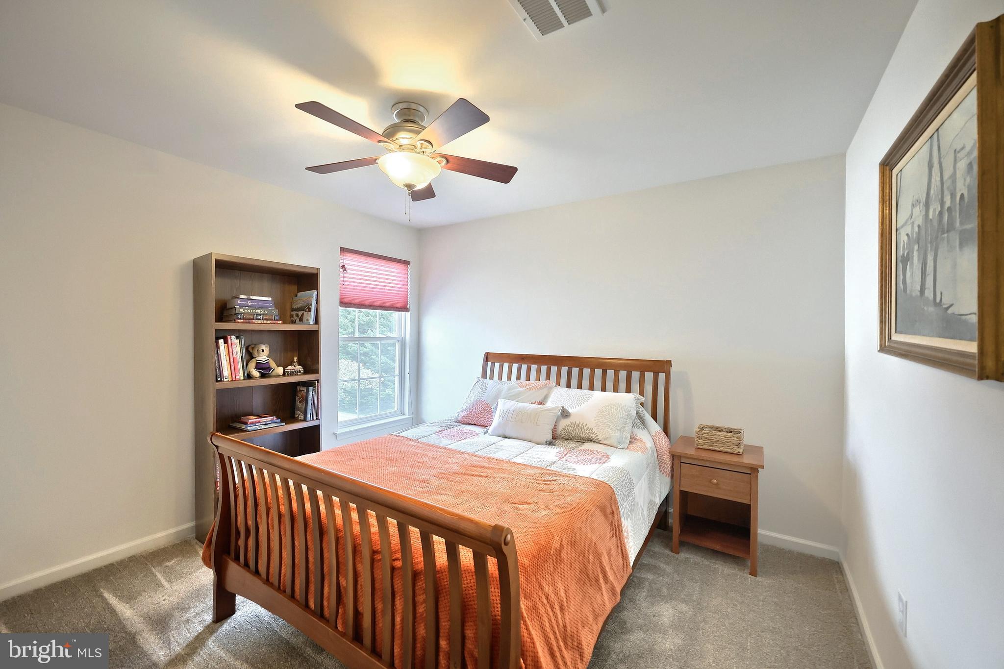 44 Smith Mill Road New Freedom, PA 17349 - Photo 33 of 51 a bedroom with a large bed and a chandelier