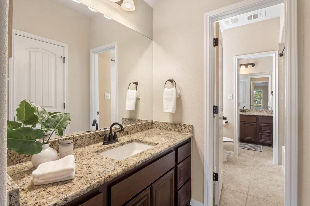 129 Camp Verde Drive Georgetown, TX 78633 - Photo 29 of 39 Jack and Jill bathroom first floor w/ tile floors & granite counter top.