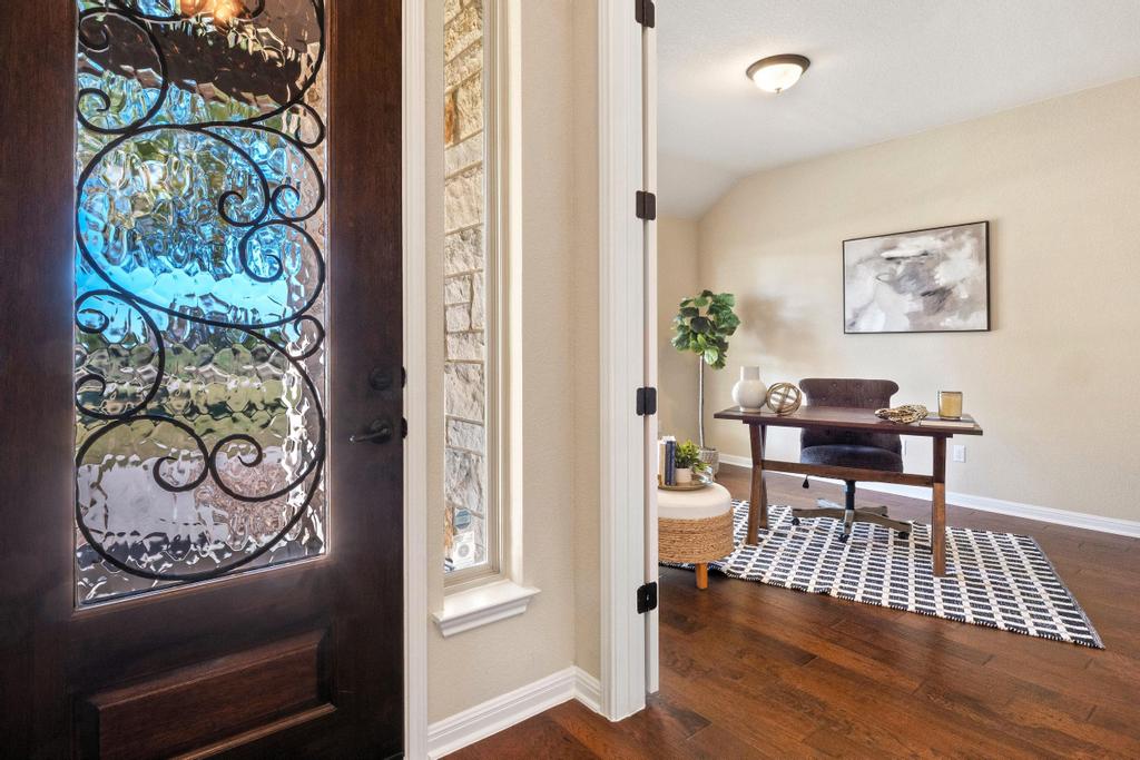 129 Camp Verde Drive Georgetown, TX 78633 - Photo 6 of 39 Foyer featuring dark wood-style floors and vaulted ceiling