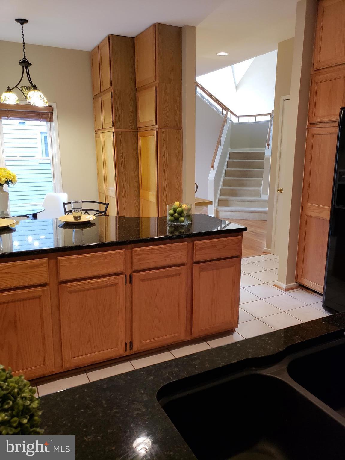 2043 Beacon Place Reston, VA 20191 - Photo 5 of 30 Kitchen view to Foyer Curved Center Staircase