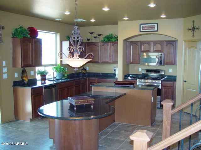 42828 West Venture Road Maricopa, AZ 85138 - Photo 2 of 6 a kitchen with counter top space and appliances