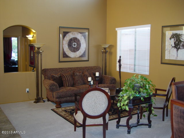 42828 West Venture Road Maricopa, AZ 85138 - Photo 4 of 6 a living room with furniture and a mirror