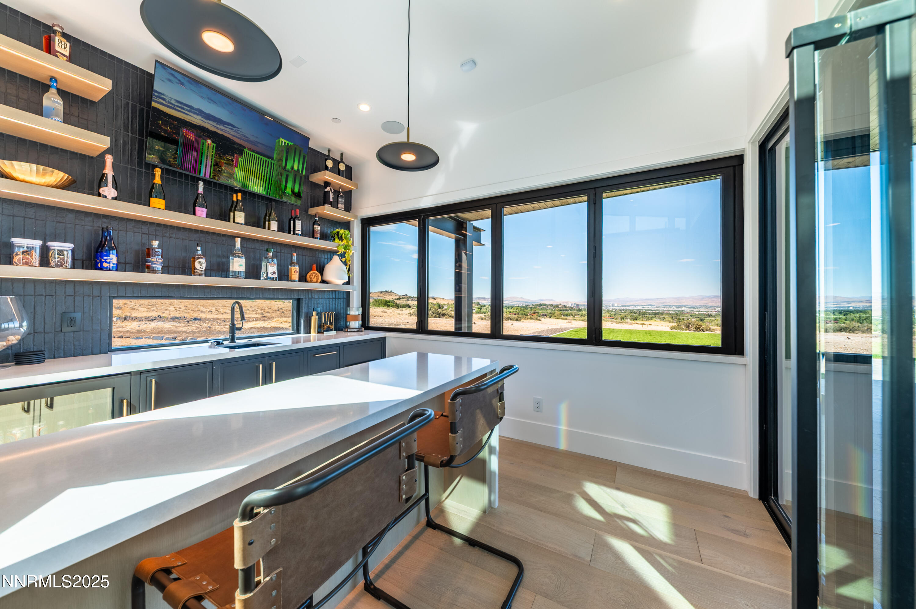 9025 Brady Ranch Road Reno, NV 89511 - Photo 15 of 42 a kitchen with stainless steel appliances granite countertop a stove a sink and a dining table with chairs