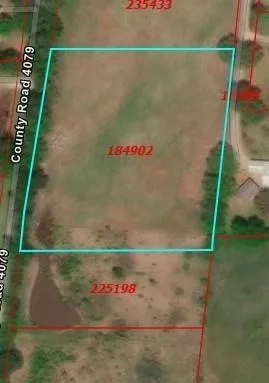 an aerial view of a house with swimming pool and a yard