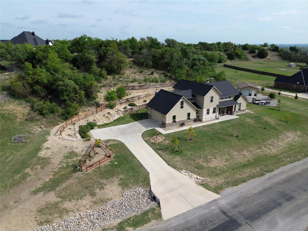 1024 Tex Lane Springtown, TX 76082 - Photo 6 of 40 an aerial view of a house with outdoor space