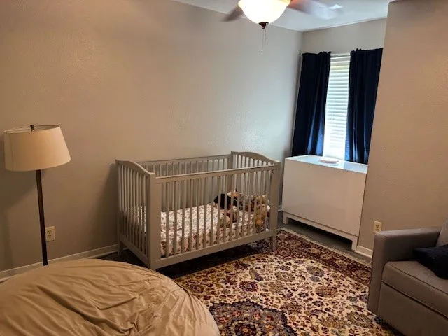 a bedroom with furniture and a window