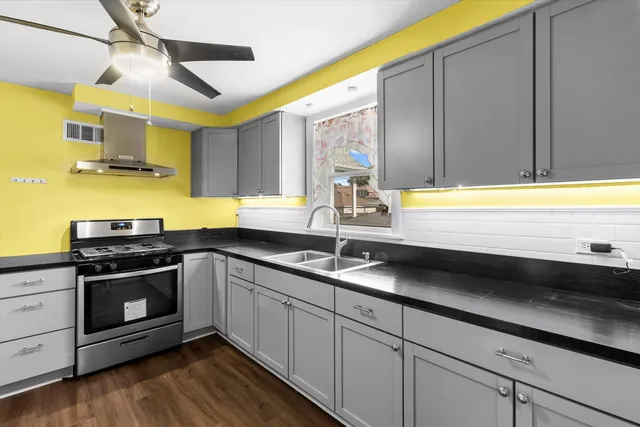 a kitchen with a sink and cabinets