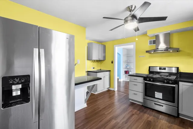 a kitchen with a refrigerator stove and a sink