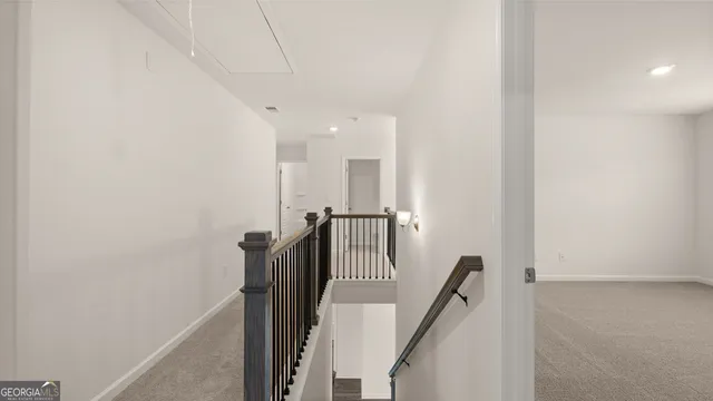 a view of a hallway with seating area