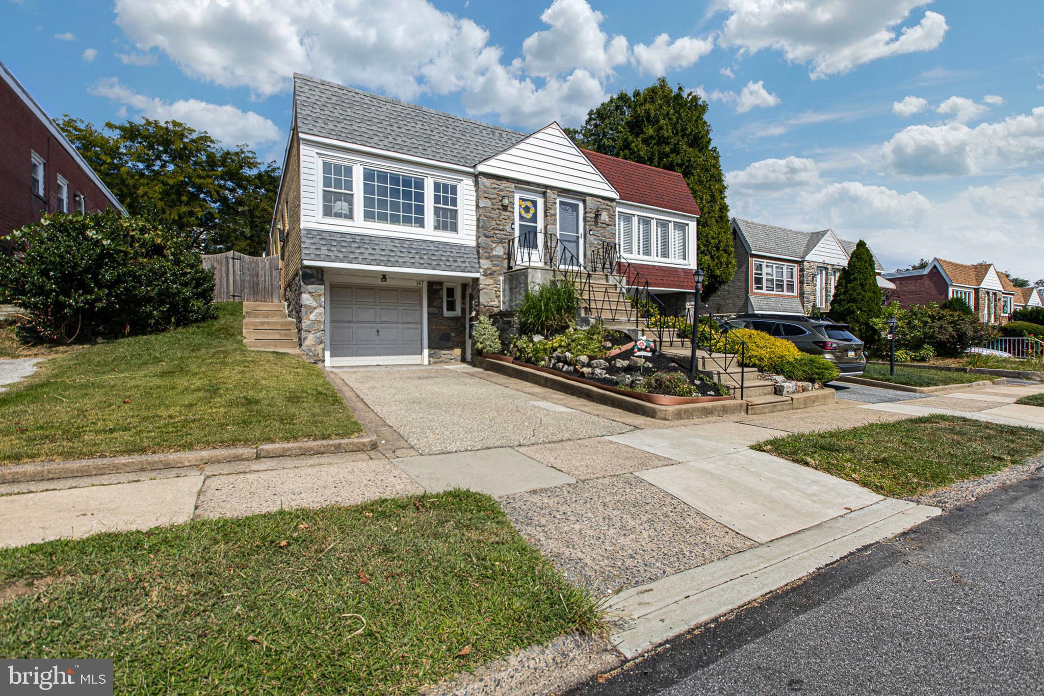 147 Juniper Road Havertown, PA 19083 - Photo 3 of 31 a front view of a house with garden