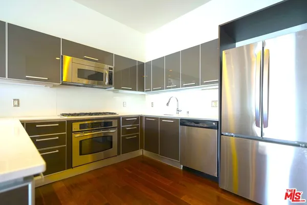 a kitchen with a sink and a stove