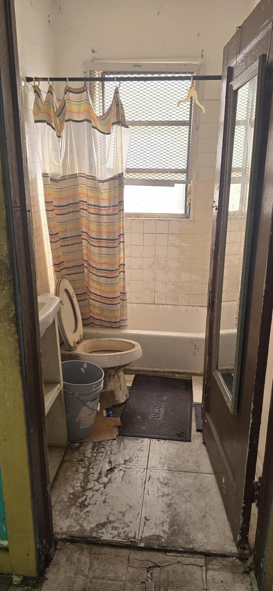 1150 West 25th Street Riviera Beach, FL 33404 - Photo 15 of 19 a bathroom with a sink and a mirror