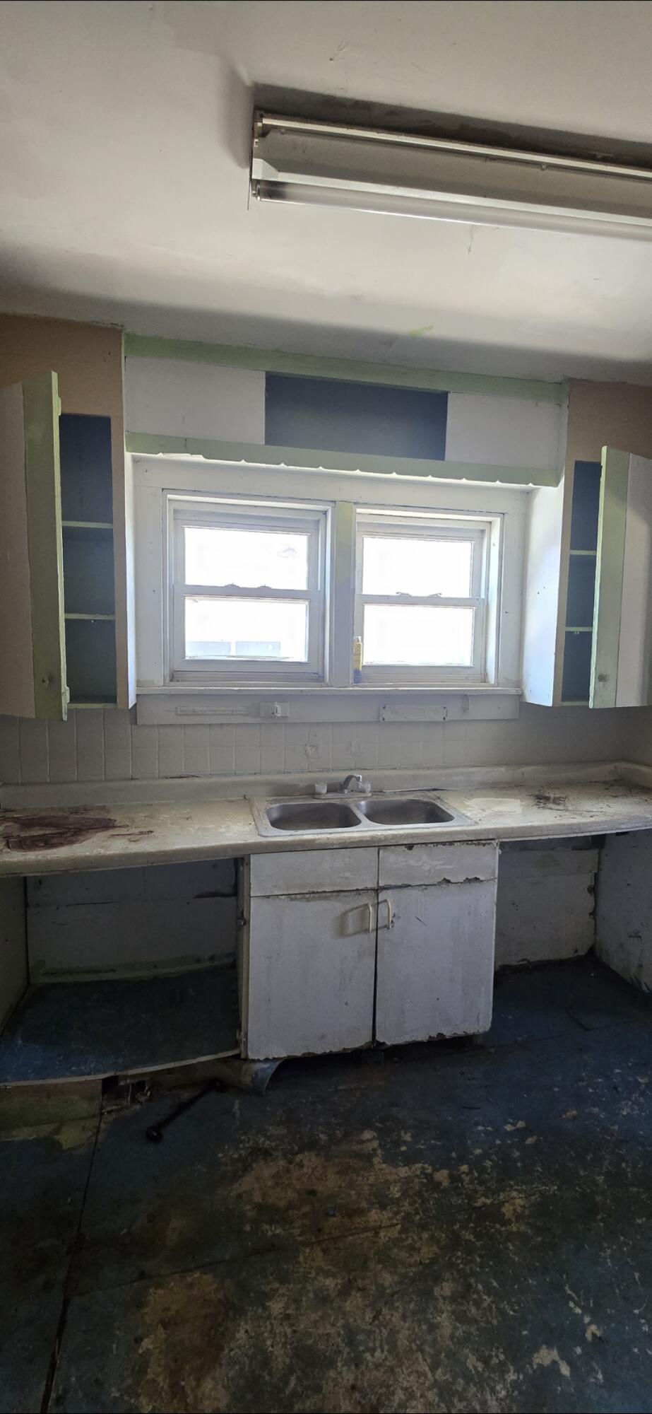 1150 West 25th Street Riviera Beach, FL 33404 - Photo 19 of 19 a view of kitchen and empty room