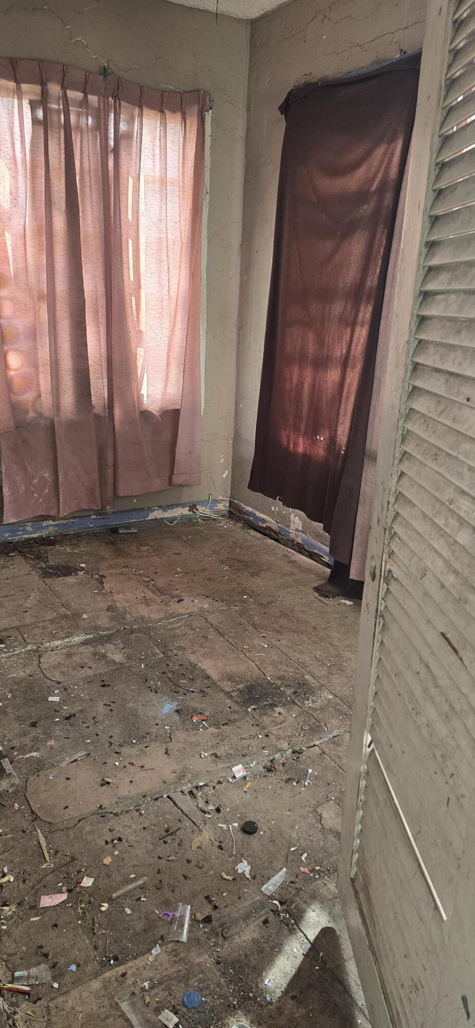 1150 West 25th Street Riviera Beach, FL 33404 - Photo 8 of 19 a view of an empty room with a window