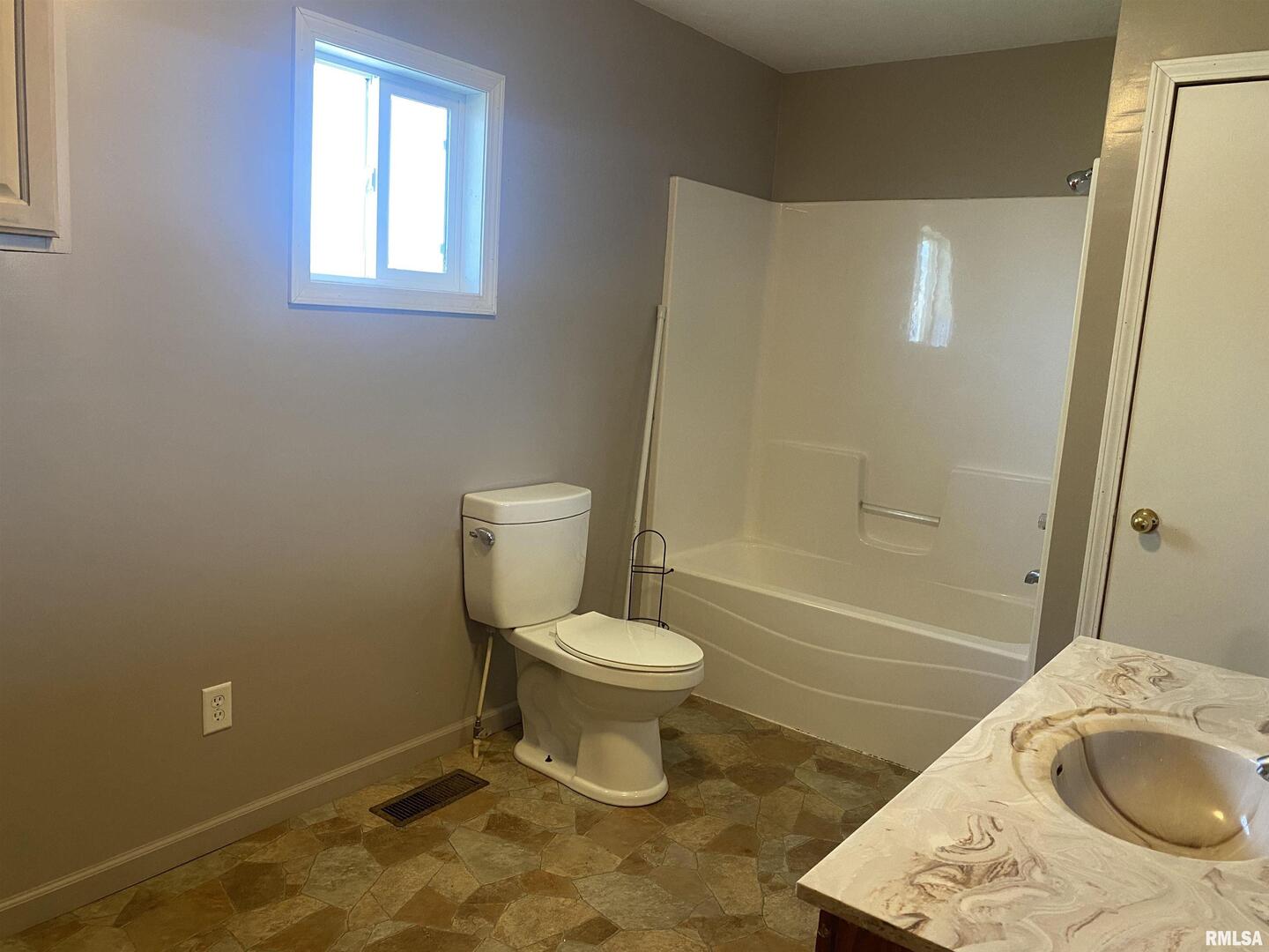 22545 Thompsonville Lake Road Thompsonville, IL 62890 - Photo 2 of 38 a bathroom with a toilet and a sink