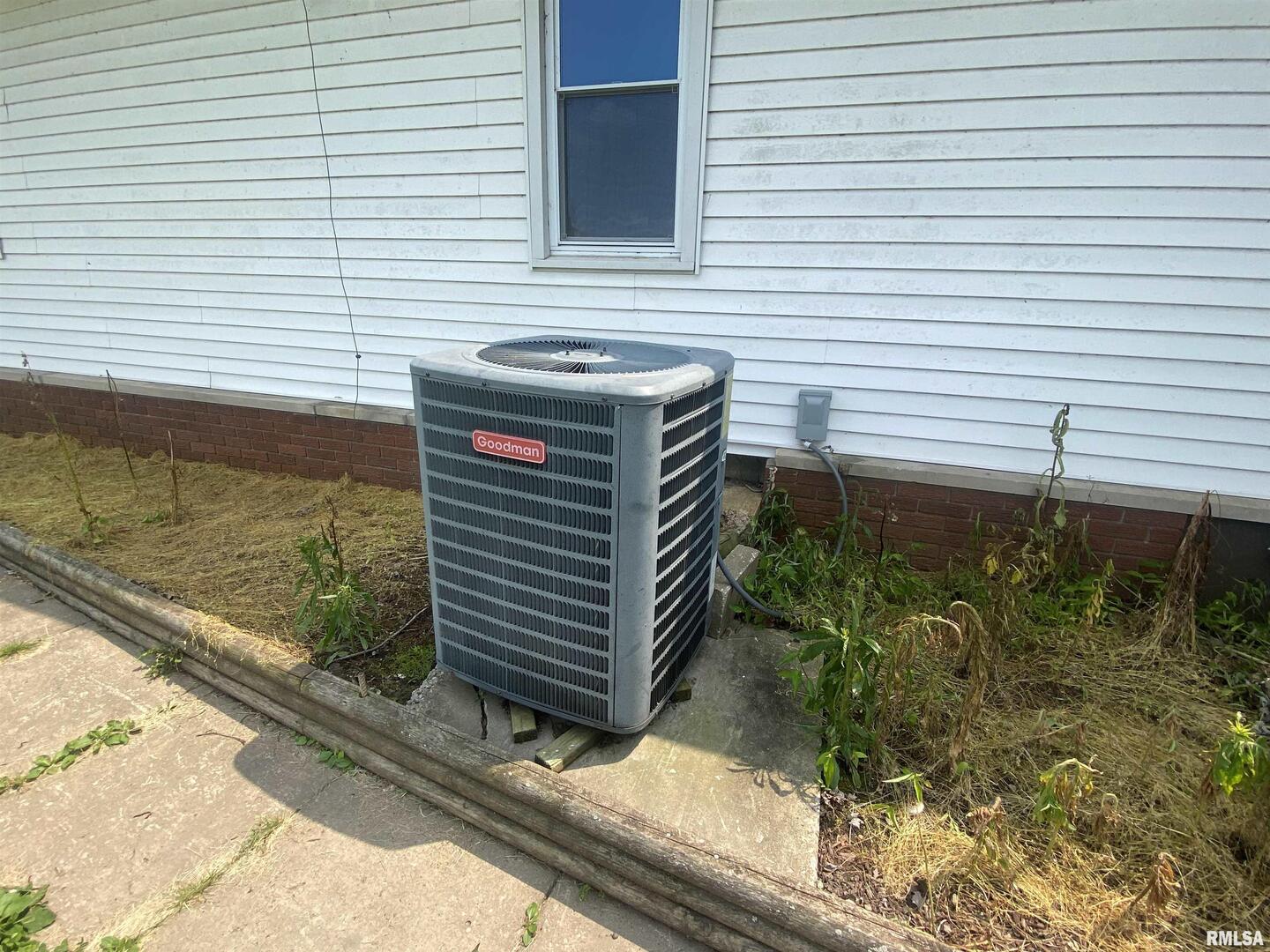 22545 Thompsonville Lake Road Thompsonville, IL 62890 - Photo 26 of 38 a view of a backyard with plants and wooden fence