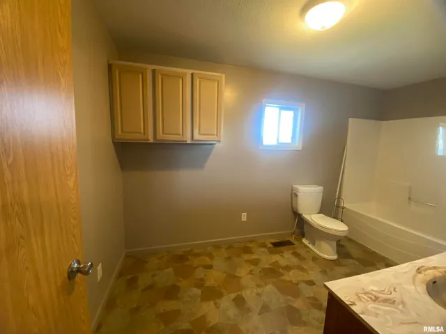 a bathroom with a sink and a toilet