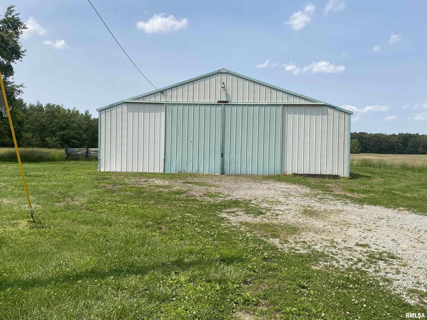 22545 Thompsonville Lake Road Thompsonville, IL 62890 - Photo 31 of 38 a view of a backyard with a garden