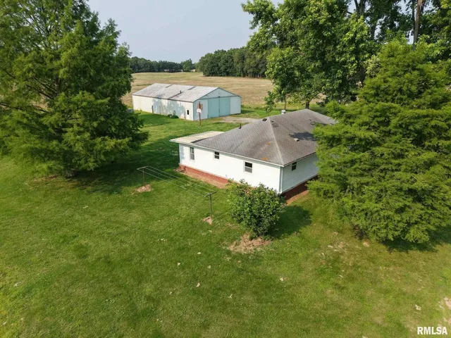 an aerial view of a house with a garden