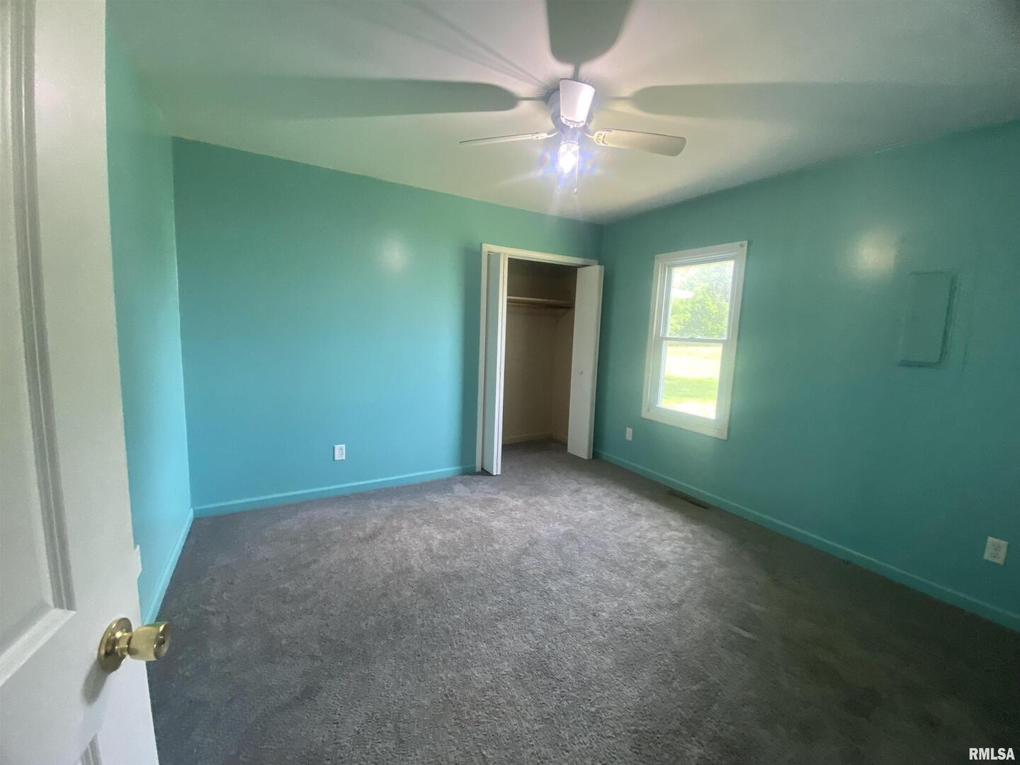 22545 Thompsonville Lake Road Thompsonville, IL 62890 - Photo 4 of 38 a view of an empty room with a window