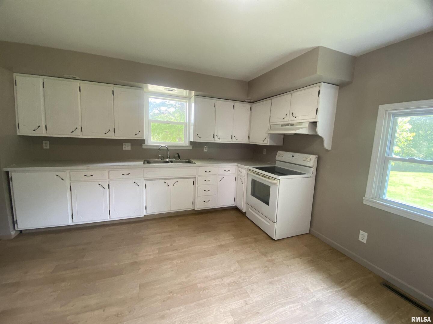 22545 Thompsonville Lake Road Thompsonville, IL 62890 - Photo 8 of 38 a kitchen with granite countertop white cabinets and white appliances