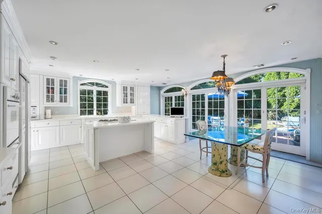 a view of a hallway with wooden floor and entryway