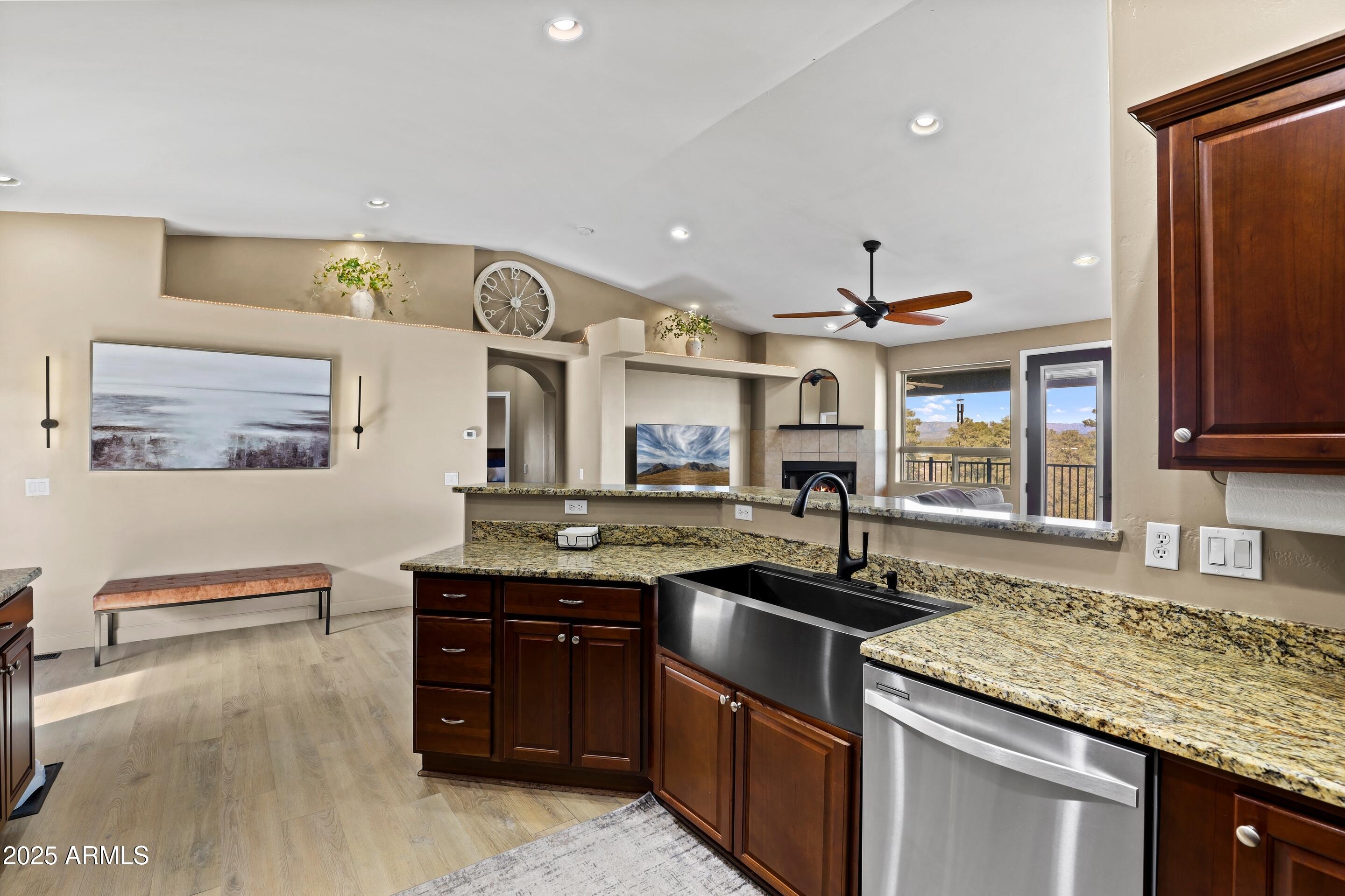 308 West Rim View Road Payson, AZ 85541 - Photo 15 of 57 a kitchen with granite countertop a sink and a stove