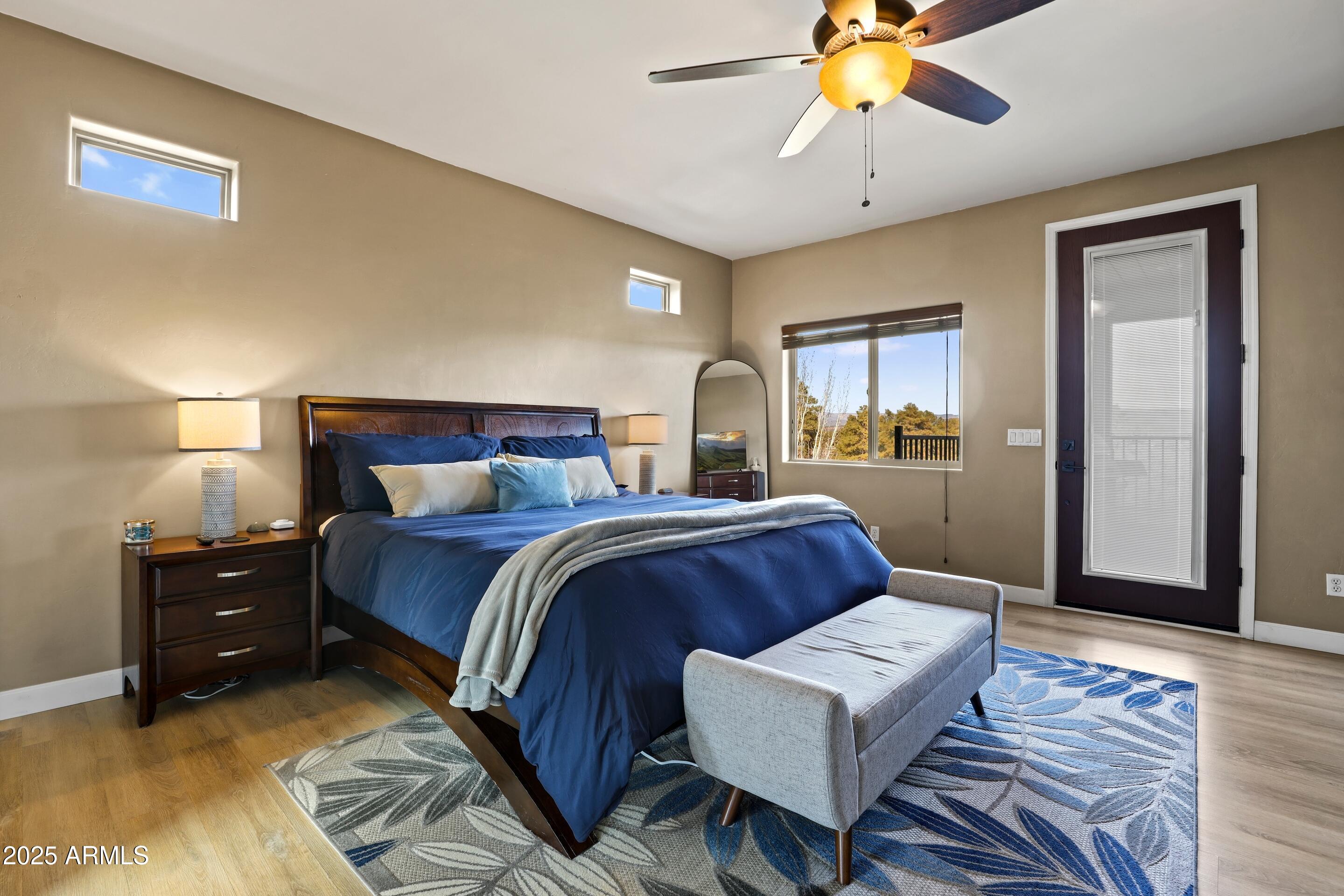 308 West Rim View Road Payson, AZ 85541 - Photo 18 of 57 a bedroom with a bed and a chandelier