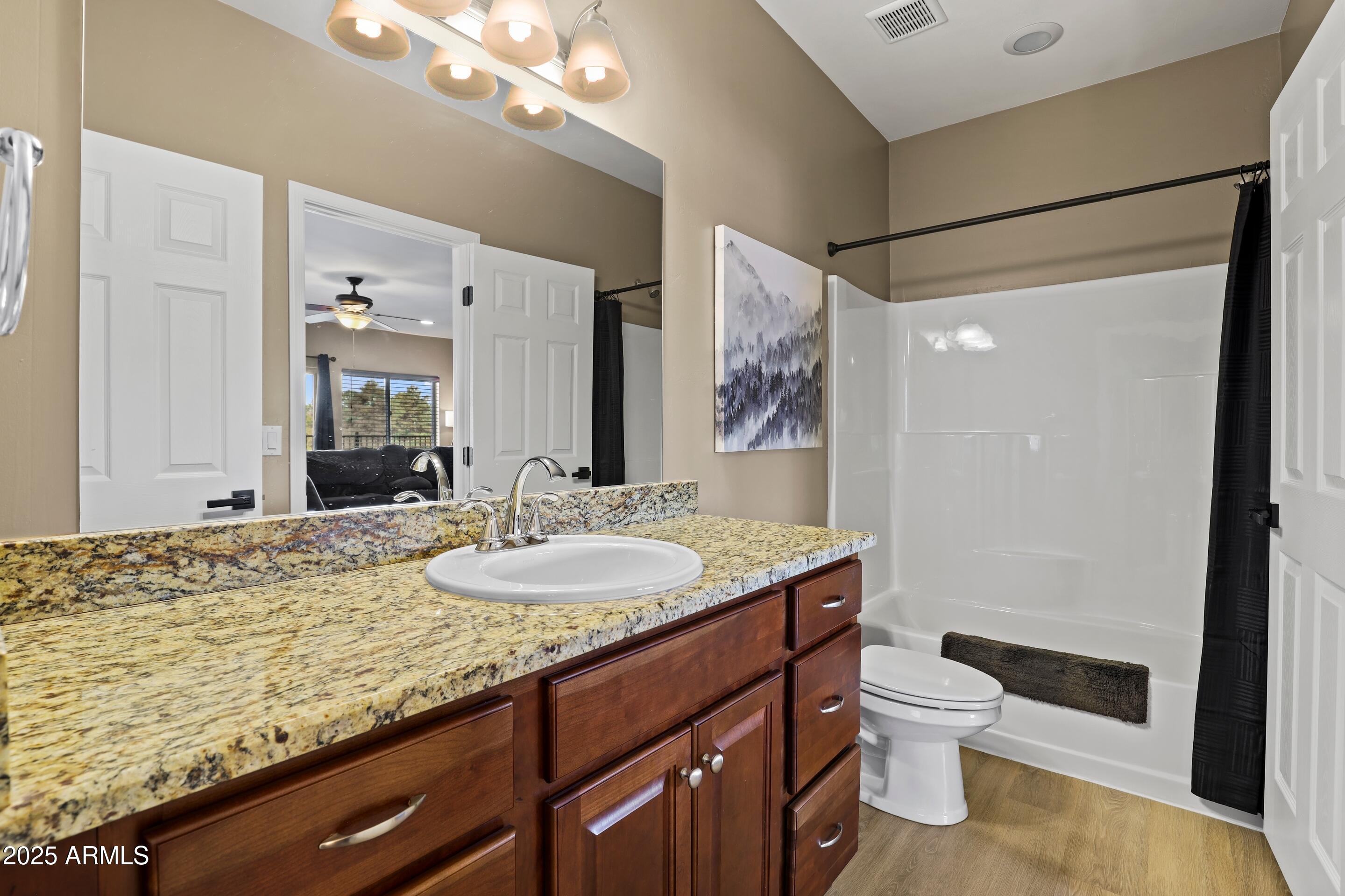 308 West Rim View Road Payson, AZ 85541 - Photo 35 of 57 a bathroom with a granite countertop sink toilet and shower