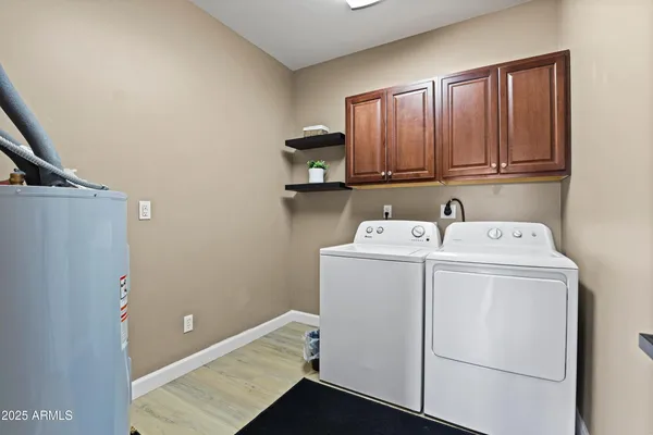 a bathroom with a granite countertop sink a vanity and a large mirror