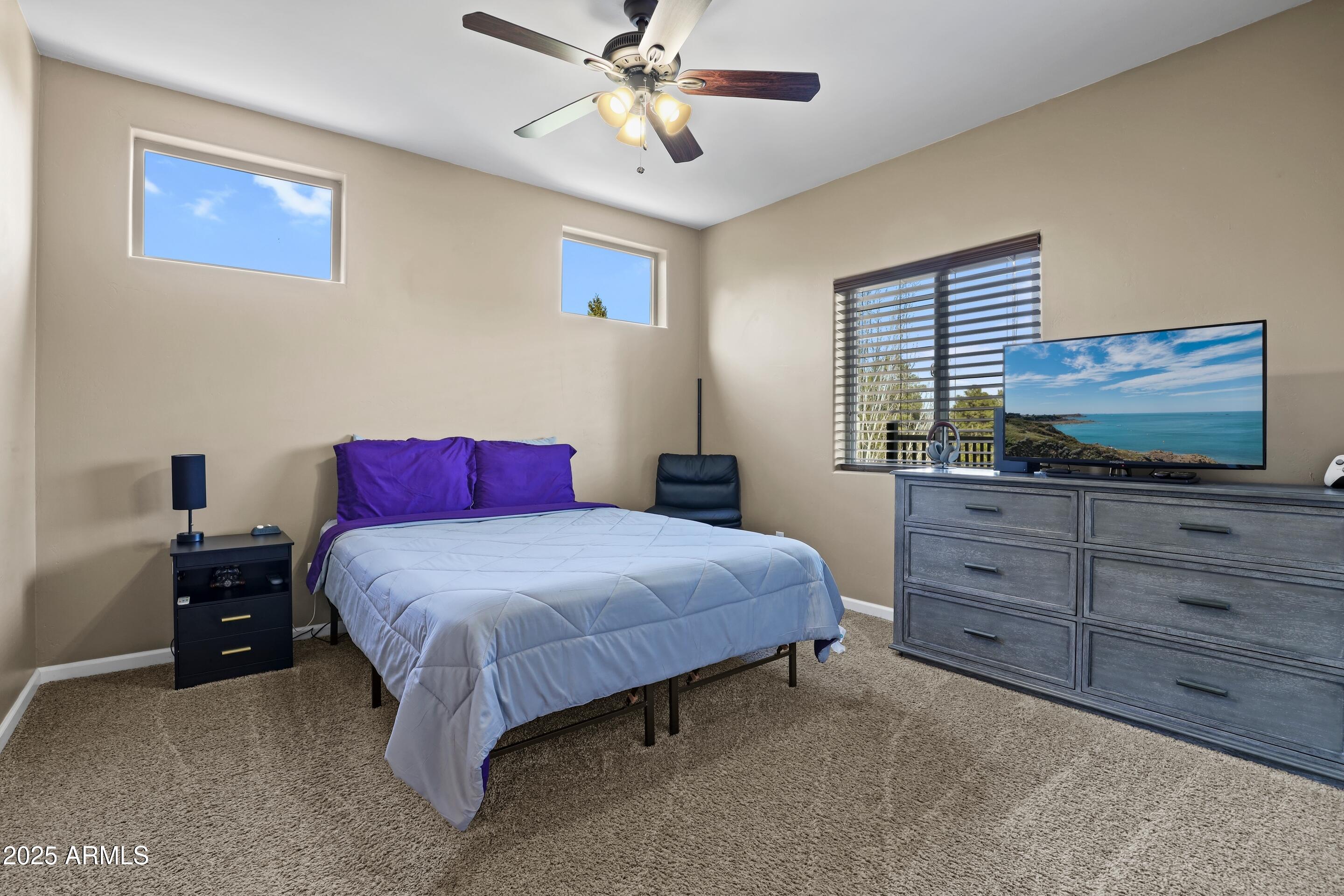 308 West Rim View Road Payson, AZ 85541 - Photo 38 of 57 a bedroom with a bed and a dresser