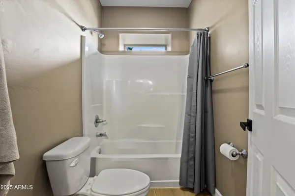 a view of wooden floor with a window
