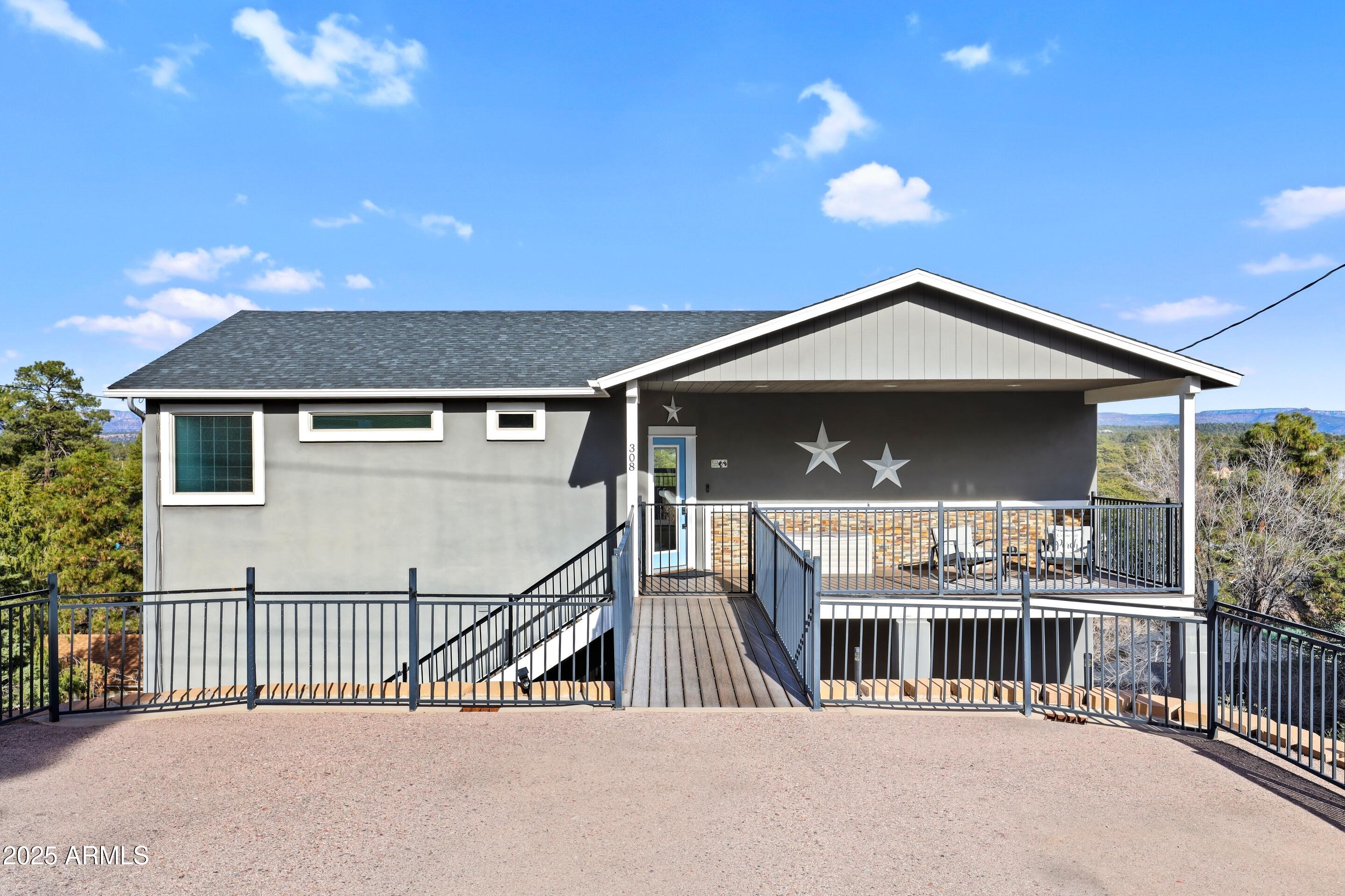 308 West Rim View Road Payson, AZ 85541 - Photo 4 of 57 a front view of a house with balcony