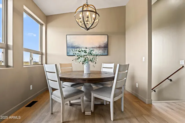 a view of a dining room with furniture window and outside view