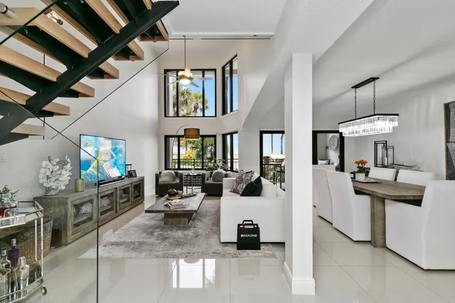 a kitchen with stainless steel appliances kitchen island granite countertop a refrigerator and a stove