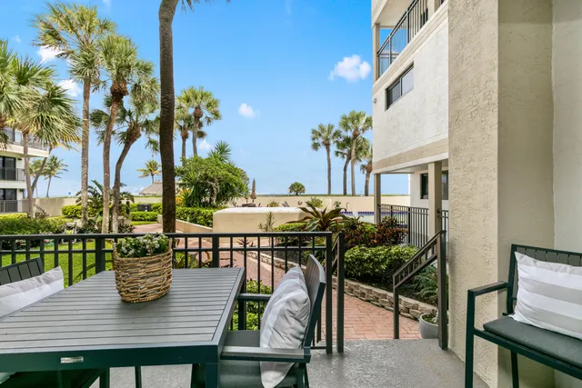 a view of a chairs and table on the patio