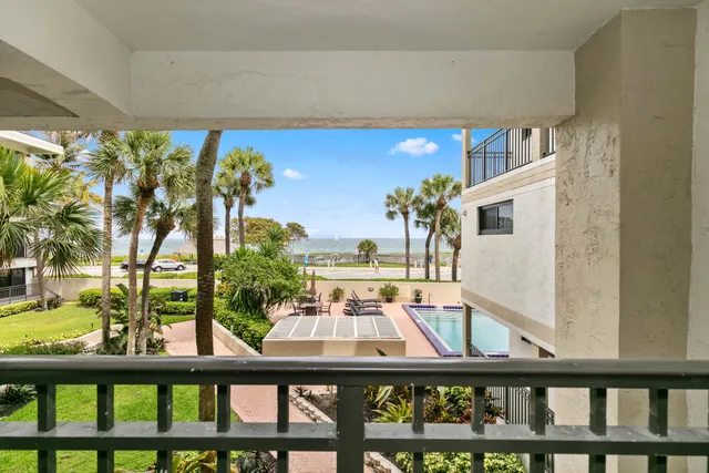 a view of a swimming pool with furniture