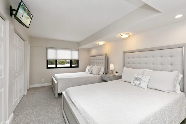 a bedroom with a bed and a lamp