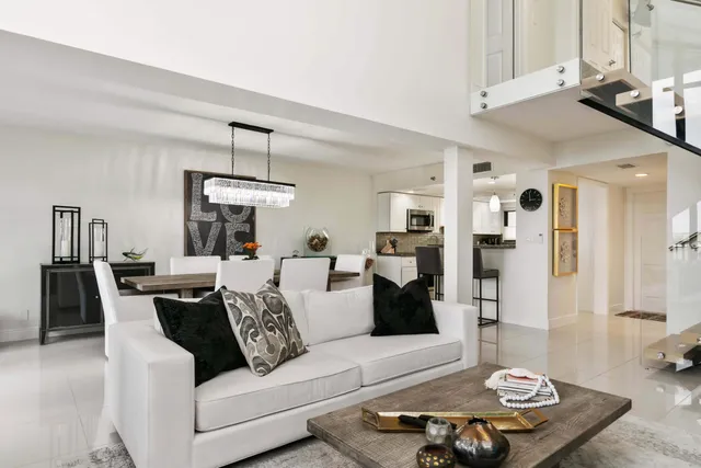 a living room with furniture and a table