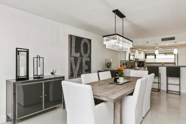a dining room with furniture and window