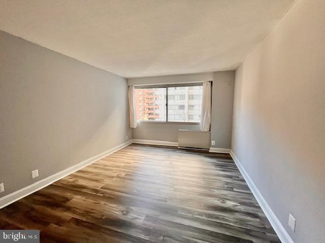 4515 Willard Avenue, Unit 1014S Chevy Chase, MD 20815 - Photo 11 of 35 wooden floor in an empty room with a window