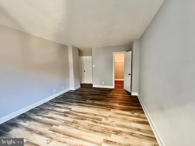 a view of a room with wooden floor and stairs