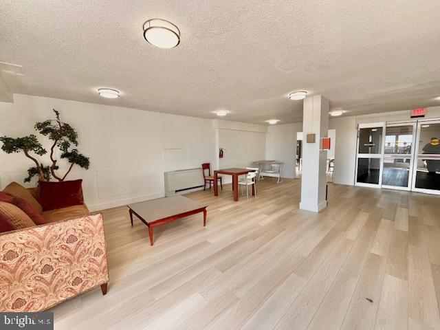 4515 Willard Avenue, Unit 1014S Chevy Chase, MD 20815 - Photo 14 of 35 a living room with furniture and a wooden floor